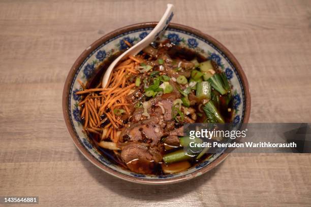 chinese spicy goulash beef noodle soup - restaurant düsseldorf stock pictures, royalty-free photos & images