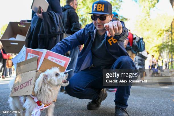 Person dressed as an FBI agent and his dog dressed as Top Secret documents Donald Trump took from the White House participate in the 32nd Annual...