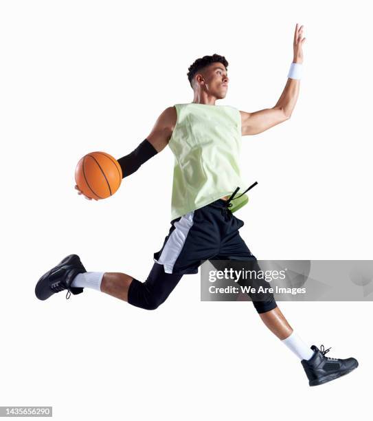 man playing with basketball - man studio shot stock pictures, royalty-free photos & images
