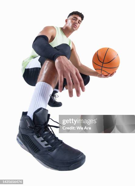 man holding basketball - basketball player stock pictures, royalty-free photos & images