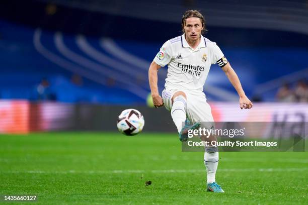 Luka Modric of Real Madrid passes the ball during the LaLiga Santander match between Real Madrid CF and Sevilla FC at Estadio Santiago Bernabeu on...