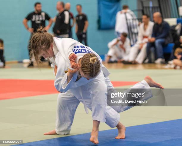 Ace Edwards of the Micklefield JC throws K. C. Franklin of the R.K Judo Club without a score eventually winning their girls junior u48kg contest by...