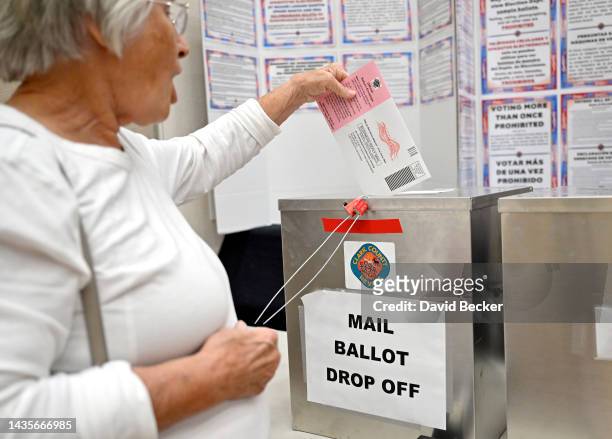 Voters deposit their mail in ballots on the first day of in-person early voting at Desert Vista Community Center on October 22, 2022 in Las Vegas,...