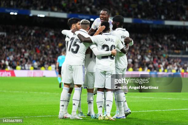 Lucas Vazquez celebrates with teammates David Alaba, Federico Valverde and Marco Asensio of Real Madrid after scoring their team's second goal during...