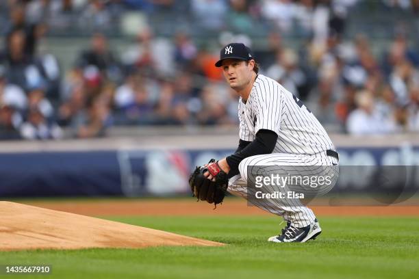 Gerrit Cole of the New York Yankees looks on between batters against the Houston Astros during the first inning in game three of the American League...