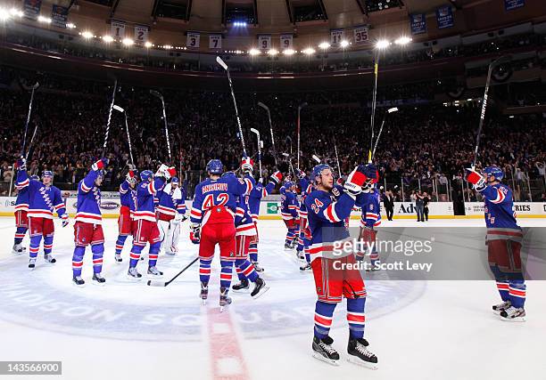 The New York Rangers salute the fans for the win against the Ottawa Senators in Game Seven of the Eastern Conference Quarterfinals during the 2012...