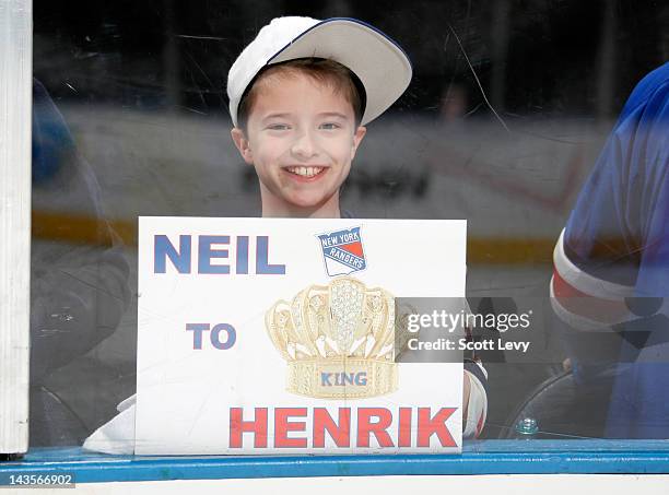 New York Rangers fan holds his sign after the win against the Ottawa Senators in Game Seven of the Eastern Conference Quarterfinals during the 2012...