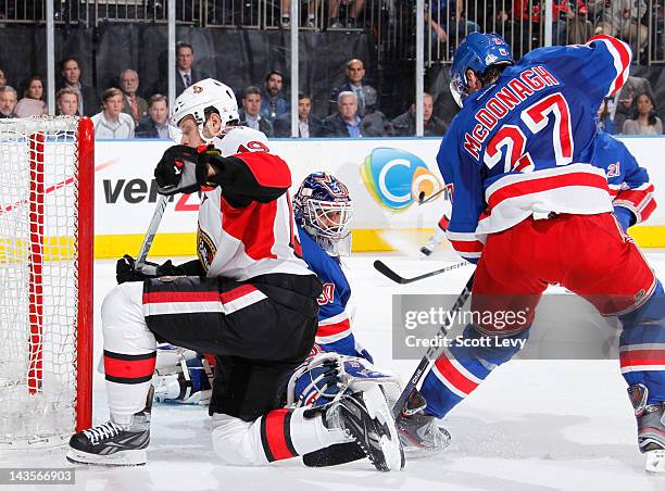 Henrik Lundqvist of the New York Rangers protects the net against Jason Spezza of the Ottawa Senators in Game Seven of the Eastern Conference...