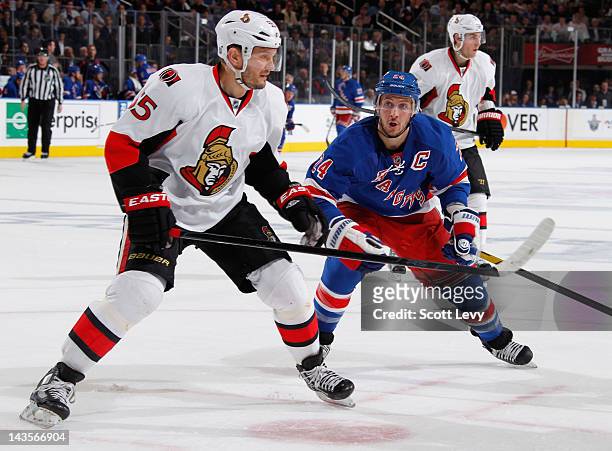Ryan Callahan of the New York Rangers skates against Sergei Gonchar of the Ottawa Senators in Game Seven of the Eastern Conference Quarterfinals...