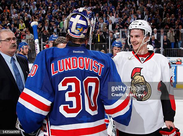 Henrik Lundqvist of the New York Rangers shakes hands with Erik Karlsson of the Ottawa Senators in Game Seven of the Eastern Conference Quarterfinals...