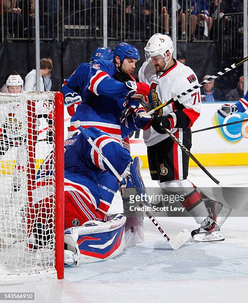 Dan Girardi of the New York Rangers defends against Nick Foligno of the Ottawa Senators in Game Seven of the Eastern Conference Quarterfinals during...