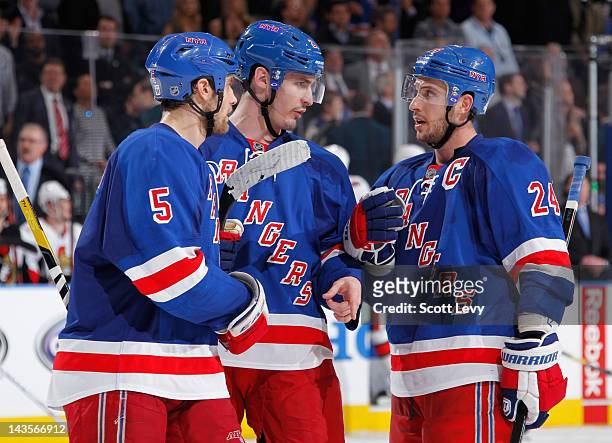 Dan Girardi, Ryan Callahan and Chris Kreider of the New York Rangers strategize during the game against the Ottawa Senators in Game Seven of the...