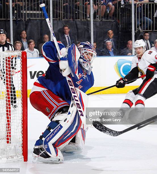 Henrik Lundqvist of the New York Rangers protects the net against the Ottawa Senators in Game Seven of the Eastern Conference Quarterfinals during...