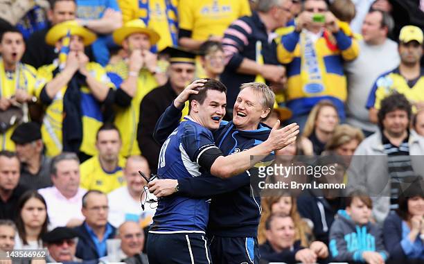 Jonathan Sexton of Leinster celebrates with Leinster Head Coach Joe Schmidt during the Heineken Cup Semi Final between ASM Clermont Auvergne and...