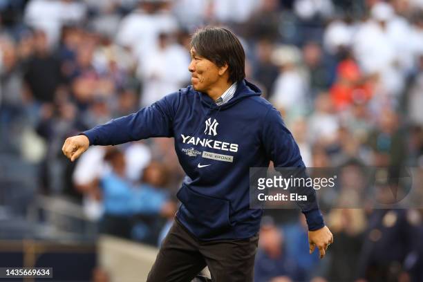 Former New York Yankees outfielder Hideki Matsui throws out a ceremonial first pitch prior to game three of the American League Championship Series...