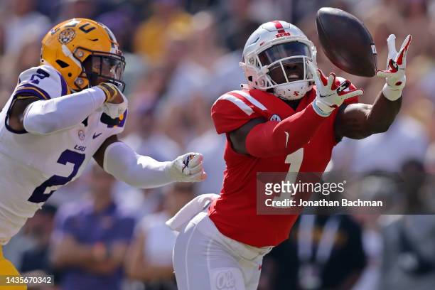 Jonathan Mingo of the Mississippi Rebels catches the ball as Mekhi Garner of the LSU Tigers defends during the first half at Tiger Stadium on October...
