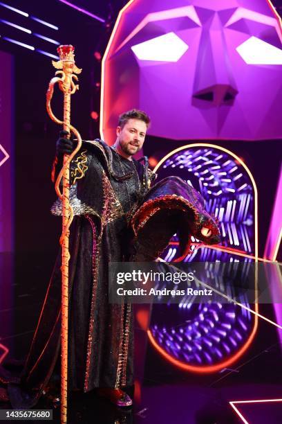 Felix von Jascheroff unmasked aka "Die Black Mamba" poses for photographers onstage after the 4th show of "The Masked Singer" on October 22, 2022 in...