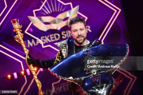Felix von Jascheroff unmasked aka "Die Black Mamba" poses for photographers onstage after the 4th show of "The Masked Singer" on October 22, 2022 in...