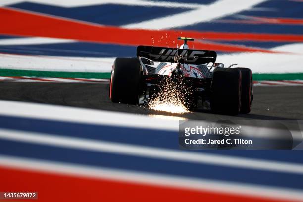 Sparks fly behind Mick Schumacher of Germany driving the Haas F1 VF-22 Ferrari on track during qualifying ahead of the F1 Grand Prix of USA at...