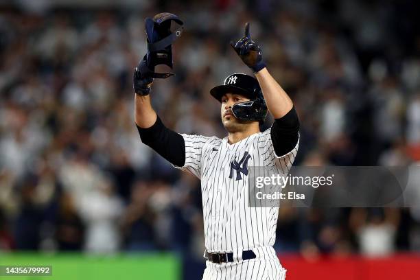 Giancarlo Stanton of the New York Yankees reacts after his double against the Houston Astros during the fourth inning in game three of the American...