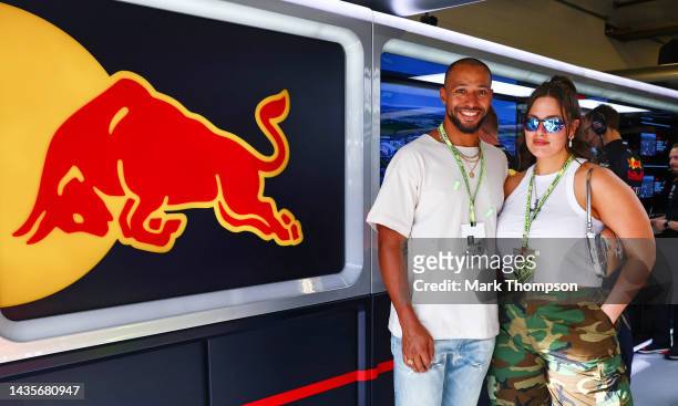 Justin Ervin and Ashley Graham pose for a photo outside the Red Bull Racing garage during qualifying ahead of the F1 Grand Prix of USA at Circuit of...