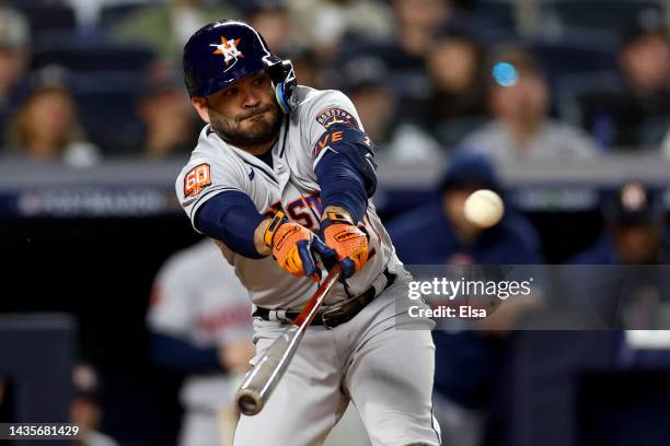 Jose Altuve of the Houston Astros hits a double against the New York Yankees during the fifth inning in game three of the American League...