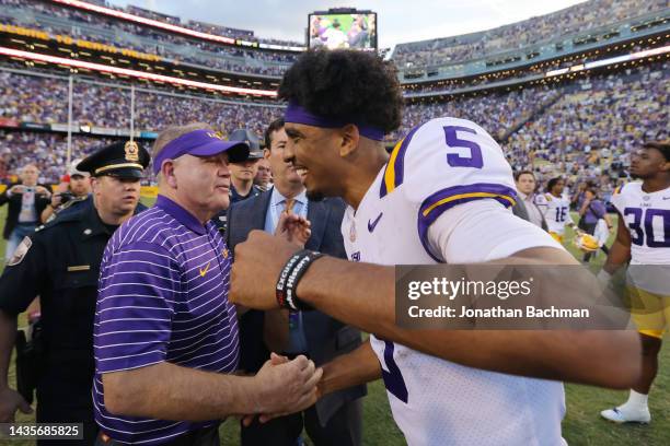 Head coach Brian Kelly and Jayden Daniels of the LSU Tigers celebrate after a game against the Mississippi Rebels at Tiger Stadium on October 22,...