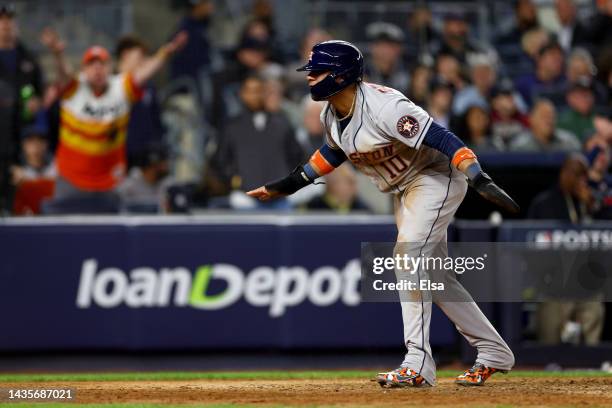 Yuli Gurriel of the Houston Astros celebrates after scoring a run against the New York Yankees during the sixth inning in game three of the American...