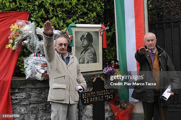 Two men attends a commemoration ceremony for the death of Italian dictator Benito Mussolini and his mistress, Claretta Petacci in front of a...
