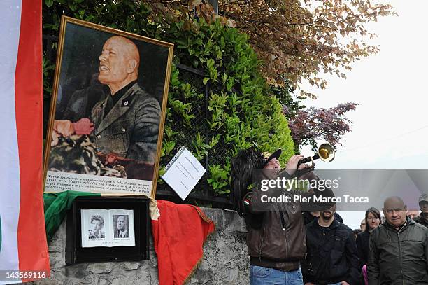 View during the commemoration ceremony for the death of Italian dictator Benito Mussolini and his mistress, Claretta Petacci in front of a headstone...