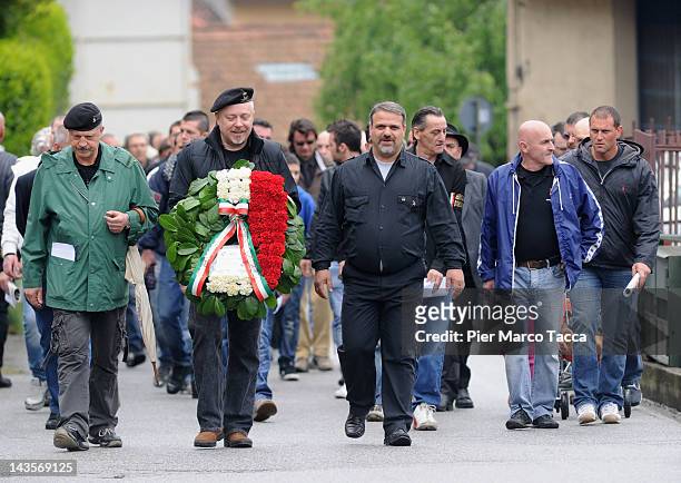 View during the commemoration ceremony for the death of Italian dictator Benito Mussolini and his mistress, Claretta Petacci in front of a headstone...