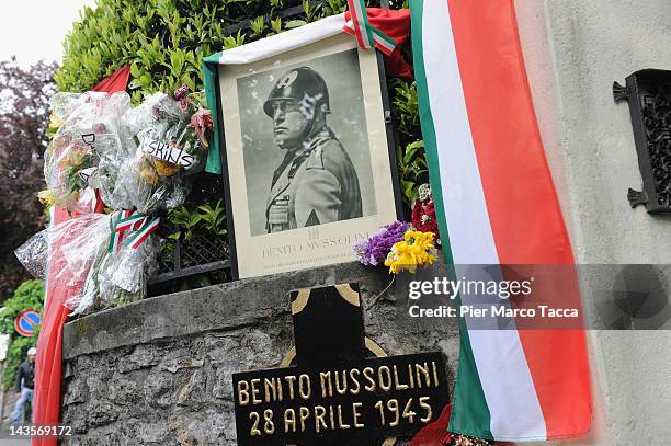 General view at commemoration ceremony for the death of Italian dictator Benito Mussolini and his mistress, Claretta Petacci in front of a headstone...