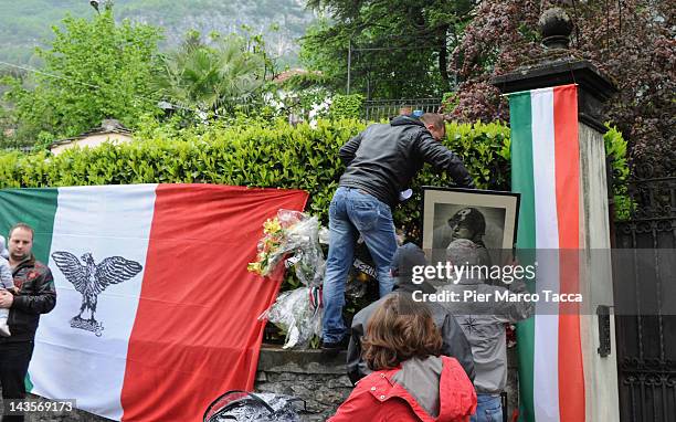 People attend the commemoration ceremony for the death of Italian dictator Benito Mussolini and his mistress, Claretta Petacci in front of a...