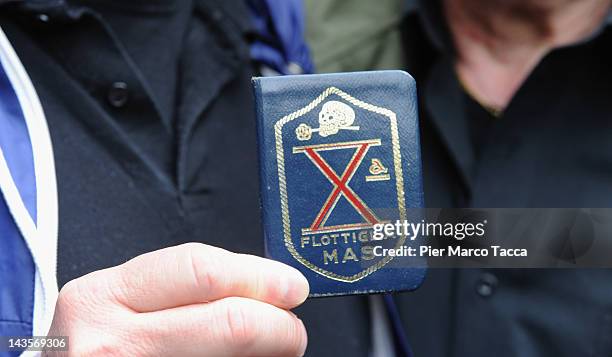 Detail of badge of fascist fighters at commemoration ceremony for the death of Italian dictator Benito Mussolini and his mistress, Claretta Petacci...