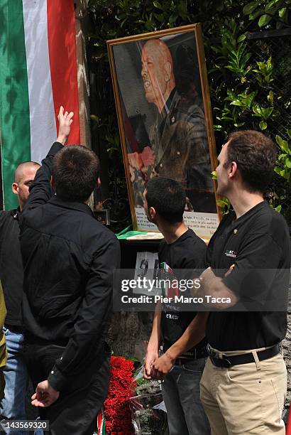 View during the commemoration ceremony for the death of Italian dictator Benito Mussolini and his mistress, Claretta Petacci in front of a headstone...