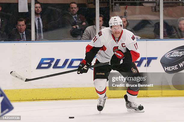 Daniel Alfredsson of the Ottawa Senators controls the puck against the New York Rangers in Game Seven of the Eastern Conference Quarterfinals during...