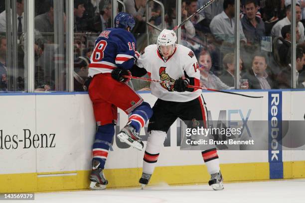 Colin Greening of the Ottawa Senators checks Marc Staal of the New York Rangers in Game Seven of the Eastern Conference Quarterfinals during the 2012...