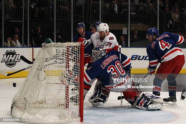 Henrik Lundqvist of the New York Rangers watches a puck fly wide against the Ottawa Senators in Game Seven of the Eastern Conference Quarterfinals...