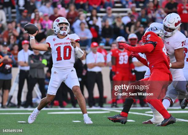 Quarterback Logan Fife of the Fresno State Bulldogs passes against the New Mexico Lobos during the first half of their game at University Stadium on...