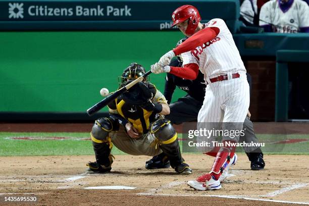 Rhys Hoskins of the Philadelphia Phillies hits a two-run home run during the first inning against the San Diego Padres in game four of the National...