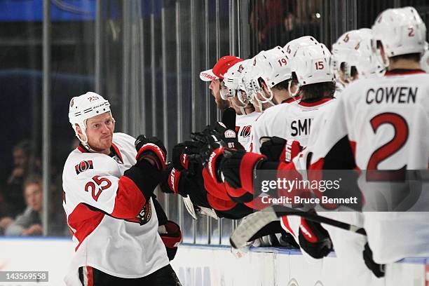 Chris Neil of the Ottawa Senators celebrates a goal by Daniel Alfredsson against the New York Rangers in the second period of Game Seven of the...