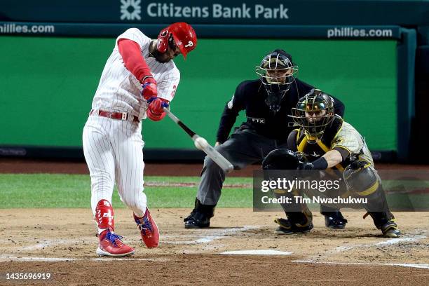 Bryce Harper of the Philadelphia Phillies hits an RBI double during the first inning against the San Diego Padres in game four of the National League...