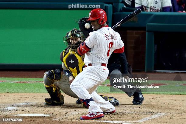 Jean Segura of the Philadelphia Phillies avoids a pitch during the first inning against the San Diego Padres in game four of the National League...