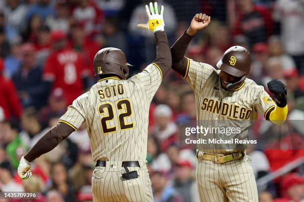 Juan Soto and Jurickson Profar of the San Diego Padres celebrate a two-run home run by Soto during the fifth inning against the Philadelphia Phillies...