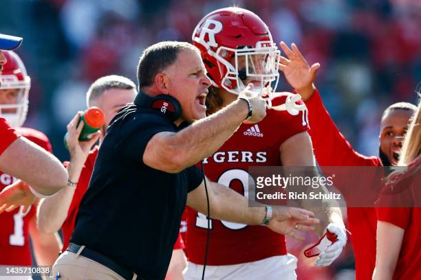 Head coach Greg Schiano of the Rutgers Scarlet Knights talks with Matt Alaimo during the fourth quarter of a college football game against the...