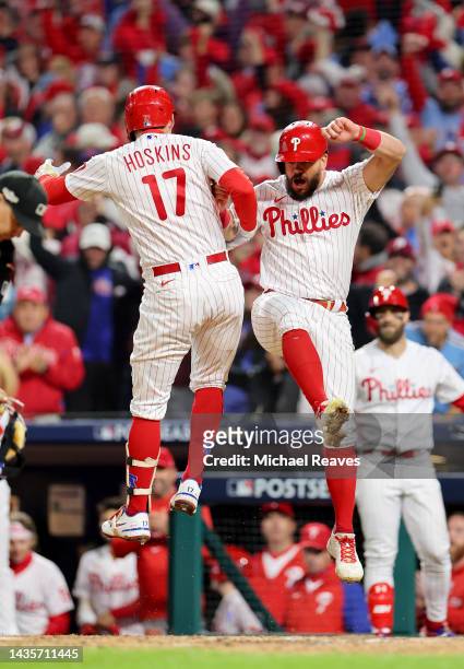 Rhys Hoskins and Kyle Schwarber of the Philadelphia Phillies celebrate a two-run home run by Hoskins during the fifth inning against the San Diego...