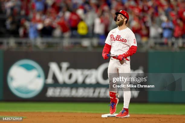 Bryce Harper of the Philadelphia Phillies reacts after his RBI double during the fifth inning against the San Diego Padres in game four of the...