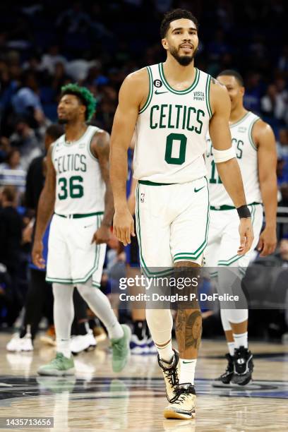 Jayson Tatum of the Boston Celtics looks on against the Orlando Magic during the fourth quarter at Amway Center on October 22, 2022 in Orlando,...