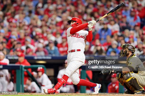 Rhys Hoskins of the Philadelphia Phillies hits a two-run home run against the San Diego Padres during the fifth inning in game four of the National...