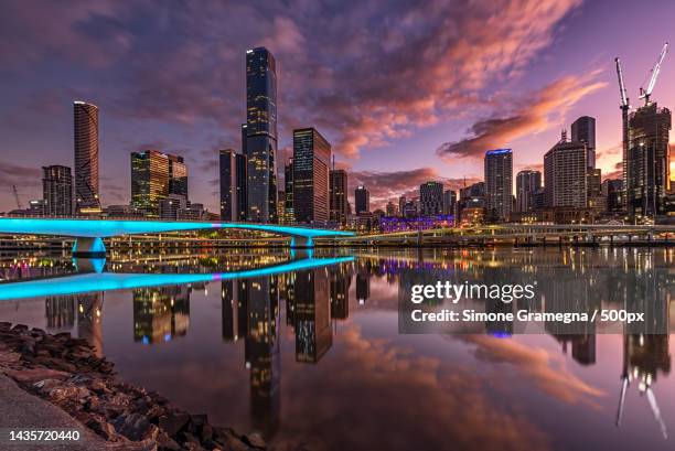 panoramic view of city lit up at night,brisbane,queensland,australia - brisbane stock pictures, royalty-free photos & images